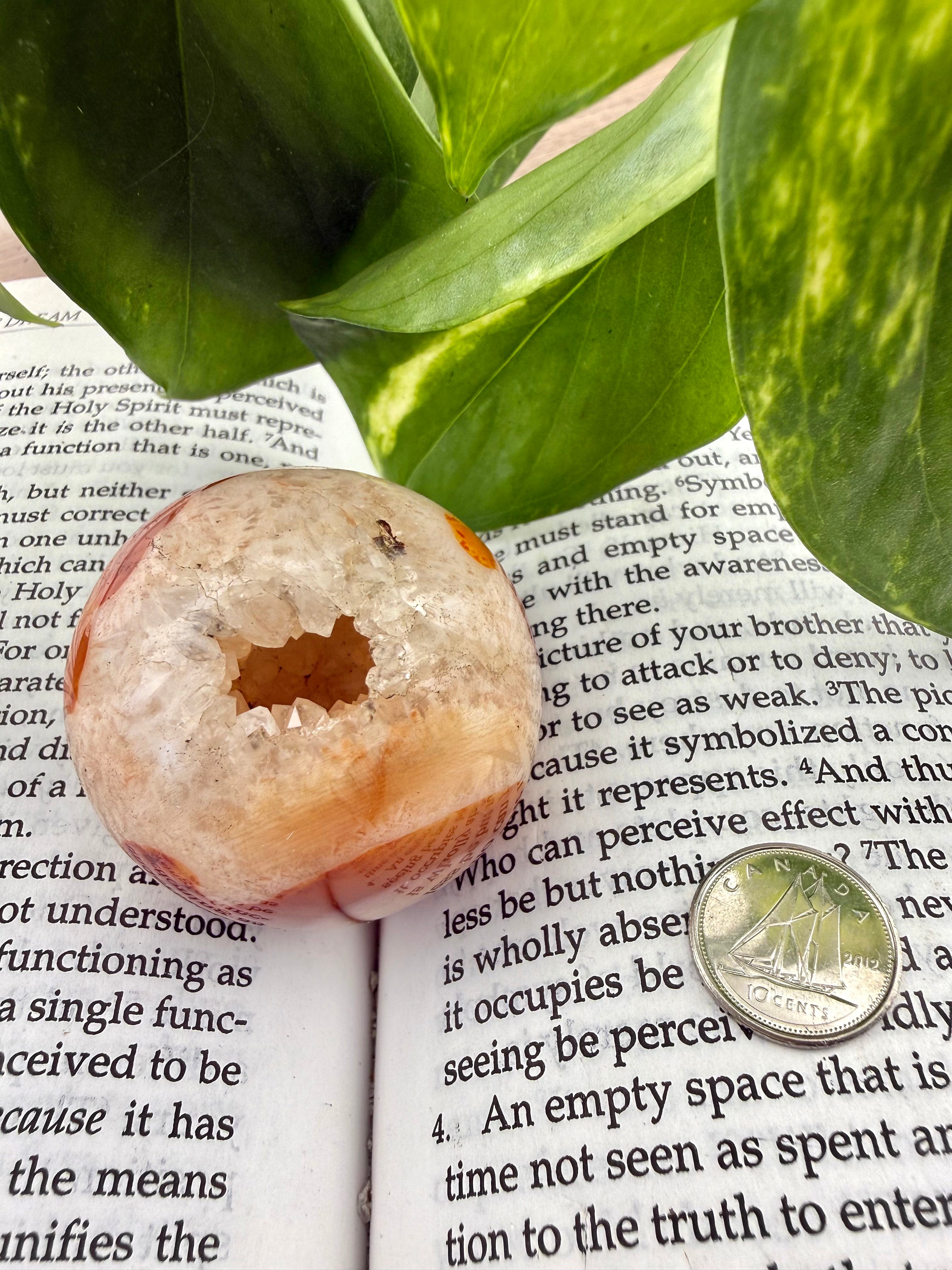 carnelian sphere with dime to show size