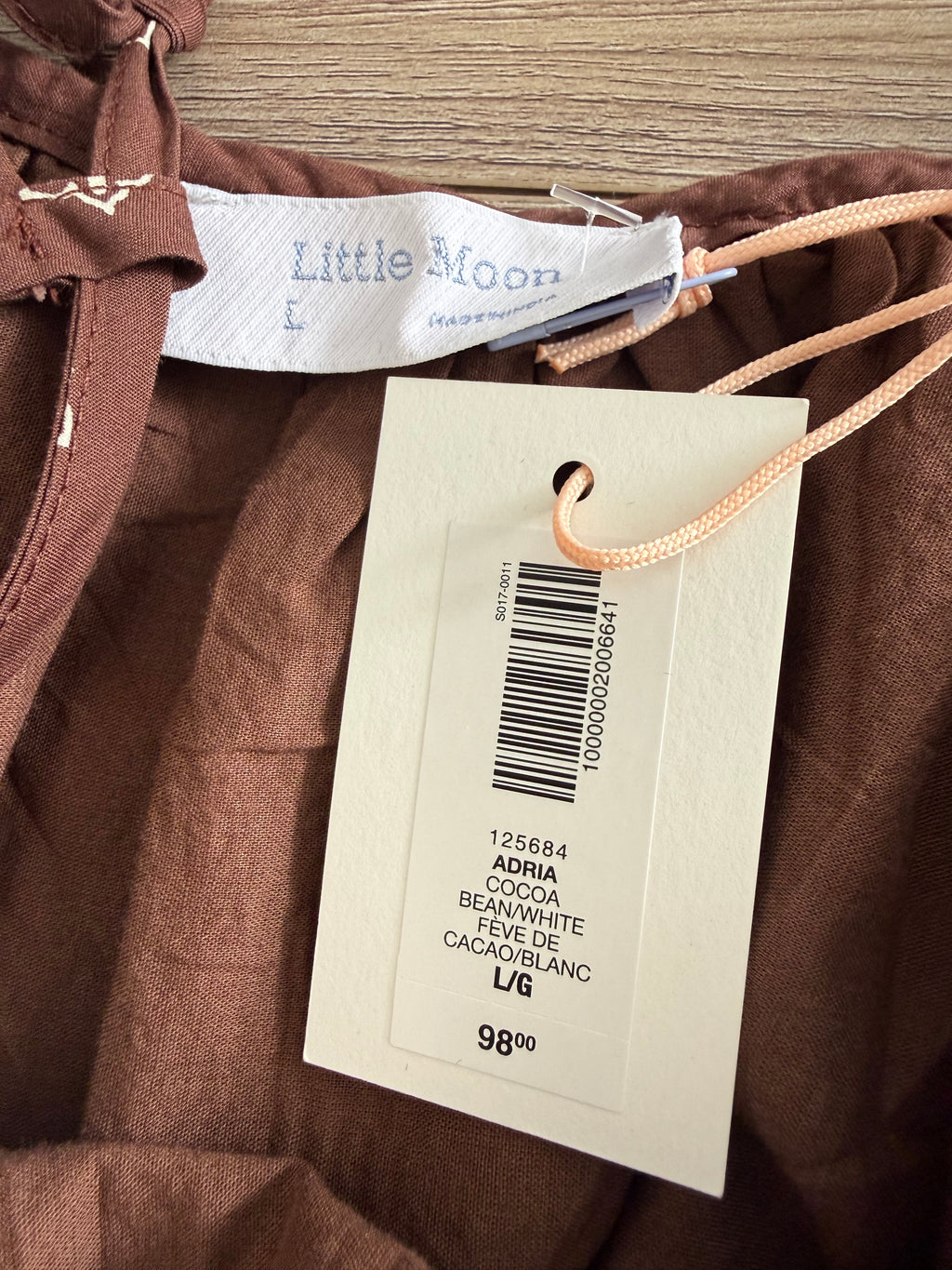 Original retail $98 shown on hang tag on little moon Aritzia dress