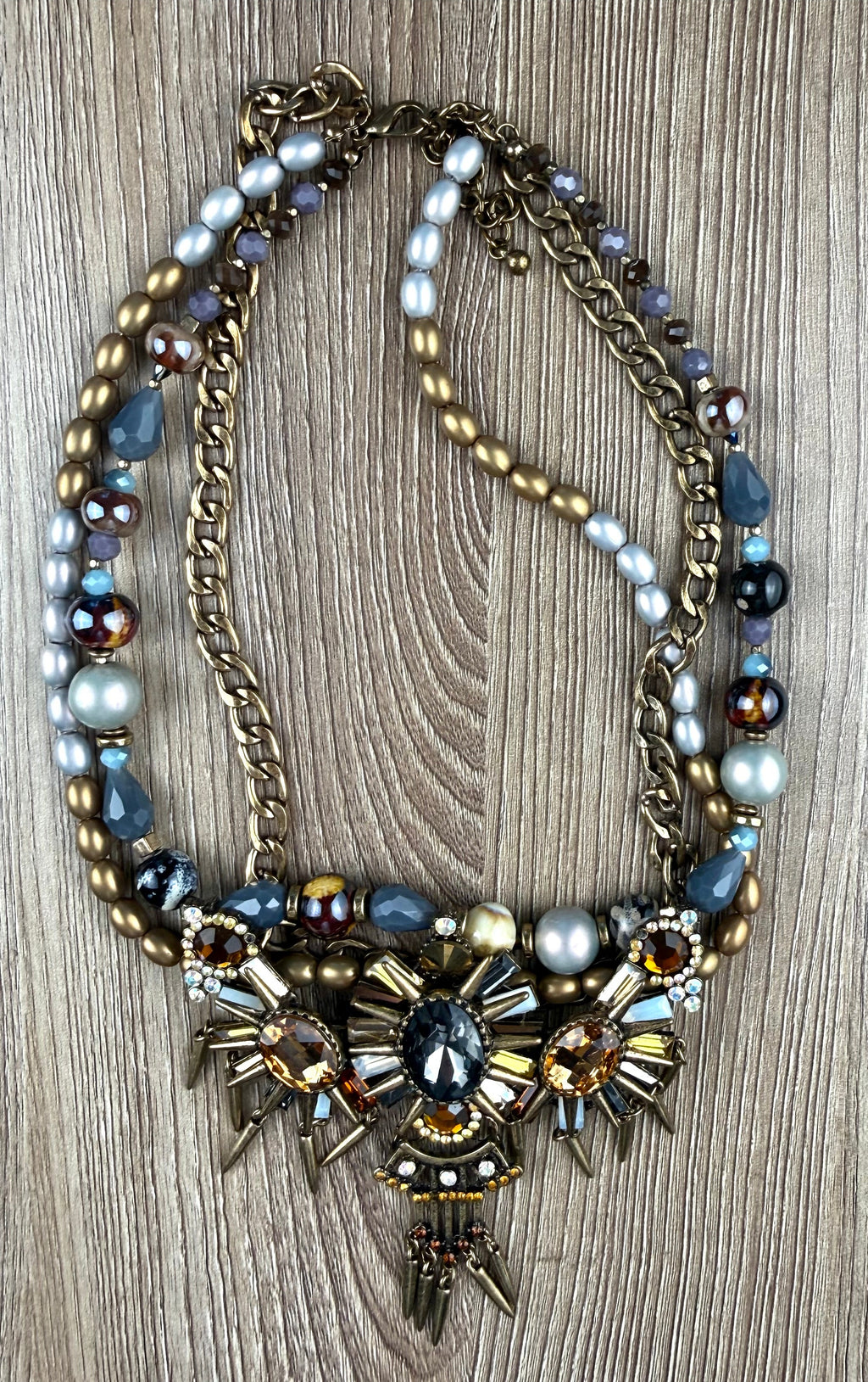 Ornate statement necklace with crystal crown centrepiece and spike accents