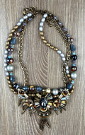 Ornate statement necklace with crystal crown centrepiece and spike accents