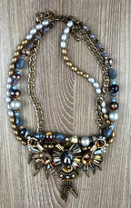 Ornate statement necklace with crystal crown centrepiece and spike accents
