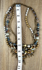 Ornate statement necklace with crystal crown centrepiece and spike accents measuring 14" neck 