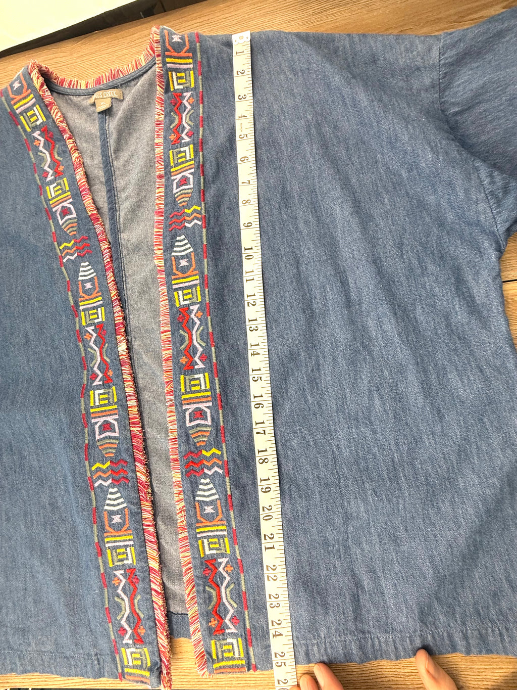 Oversize denim jacket measuring 25" shoulder to hem 