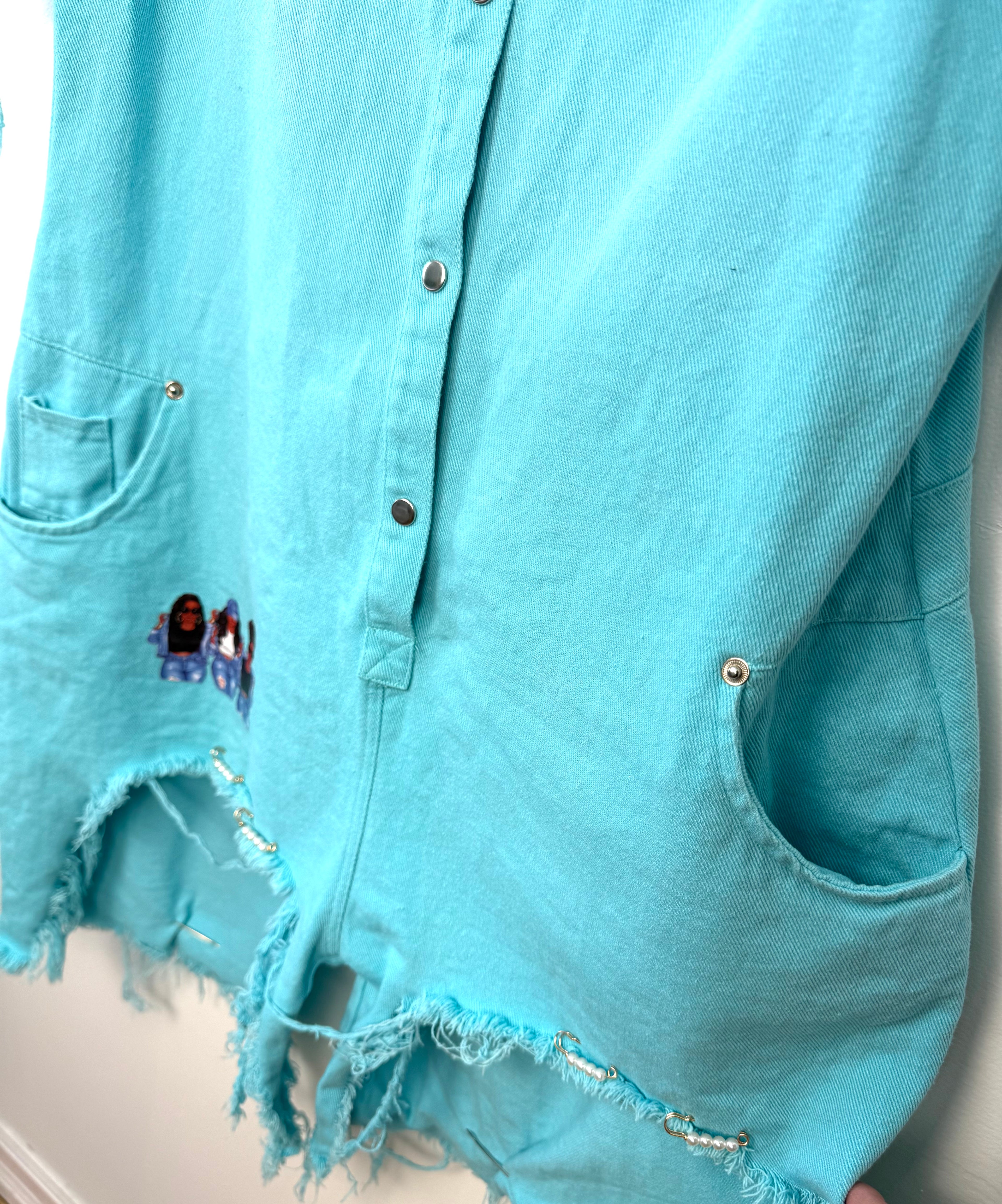 Oversized Turquoise denim romper close up of legs 