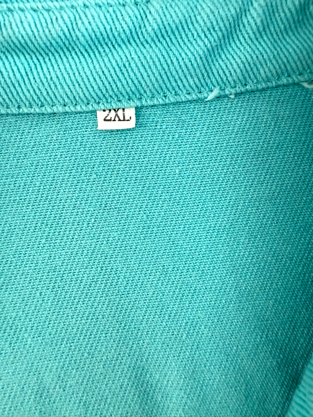 Oversized Turquoise denim romper showing 2xL tag