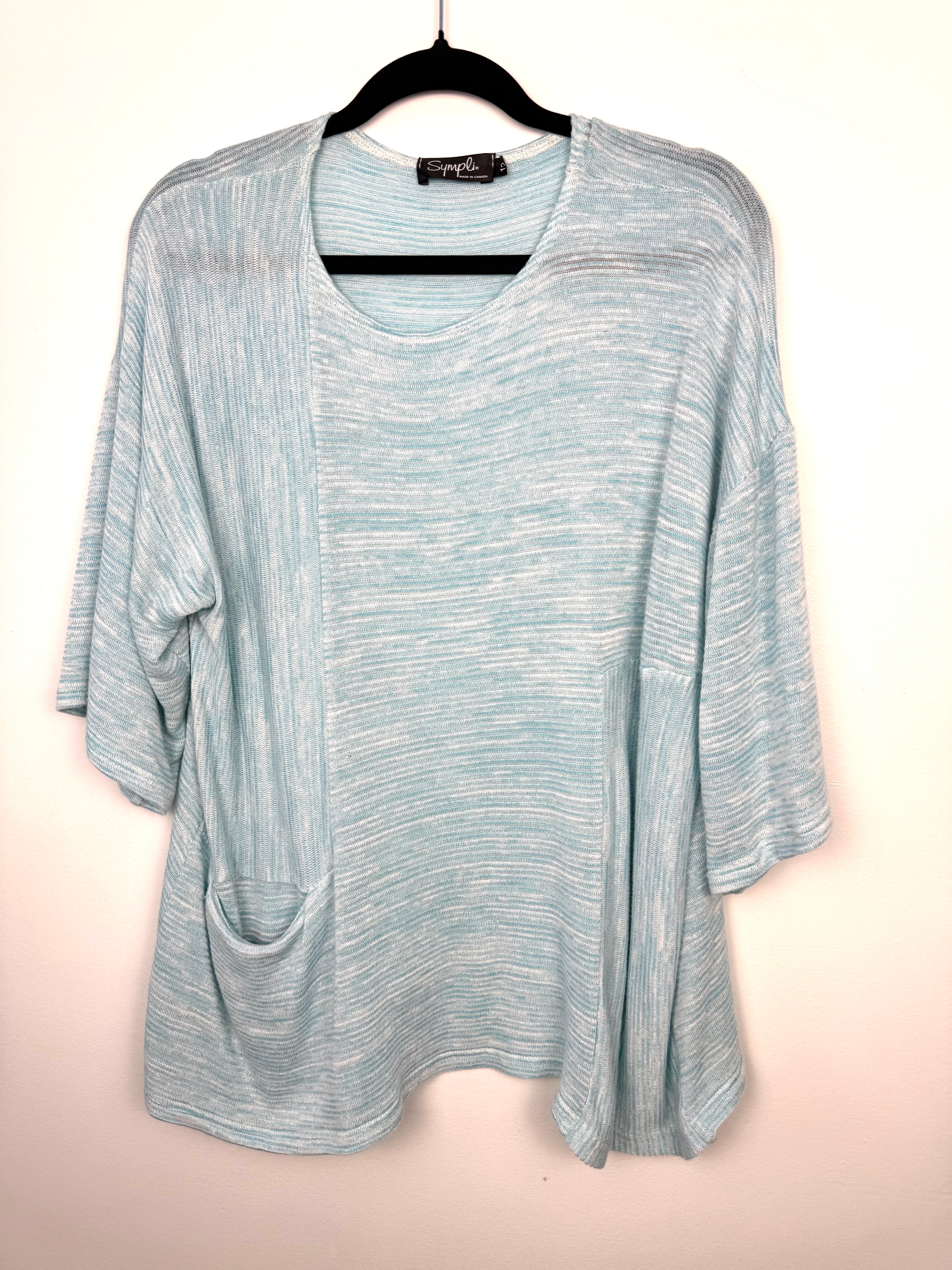 Pale Blue Sympli Knit Tunic Top with front pocket detail on hanger