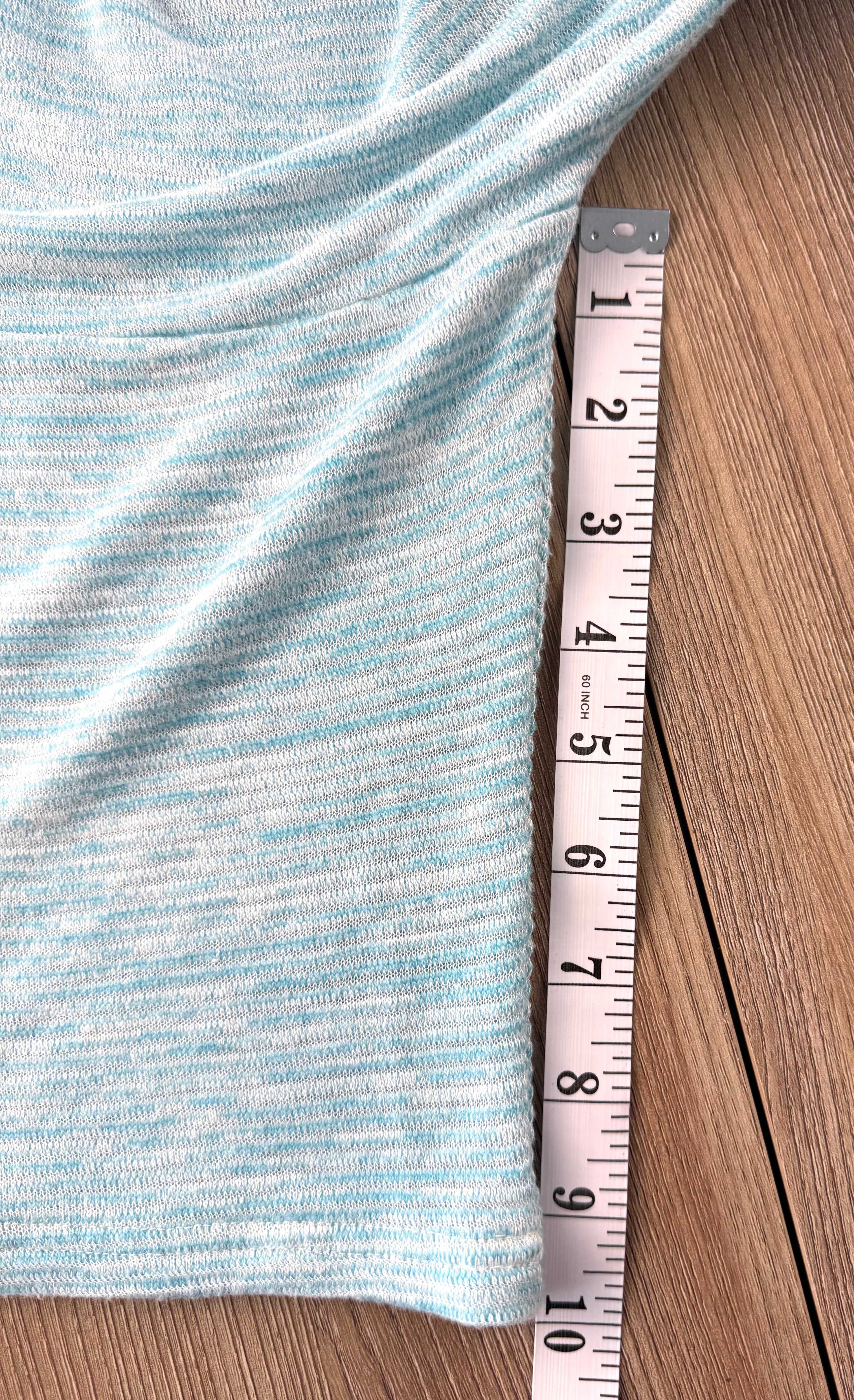 Pale Blue Sympli Knit Tunic Top with front pocket detail measuring 10" sleeve 