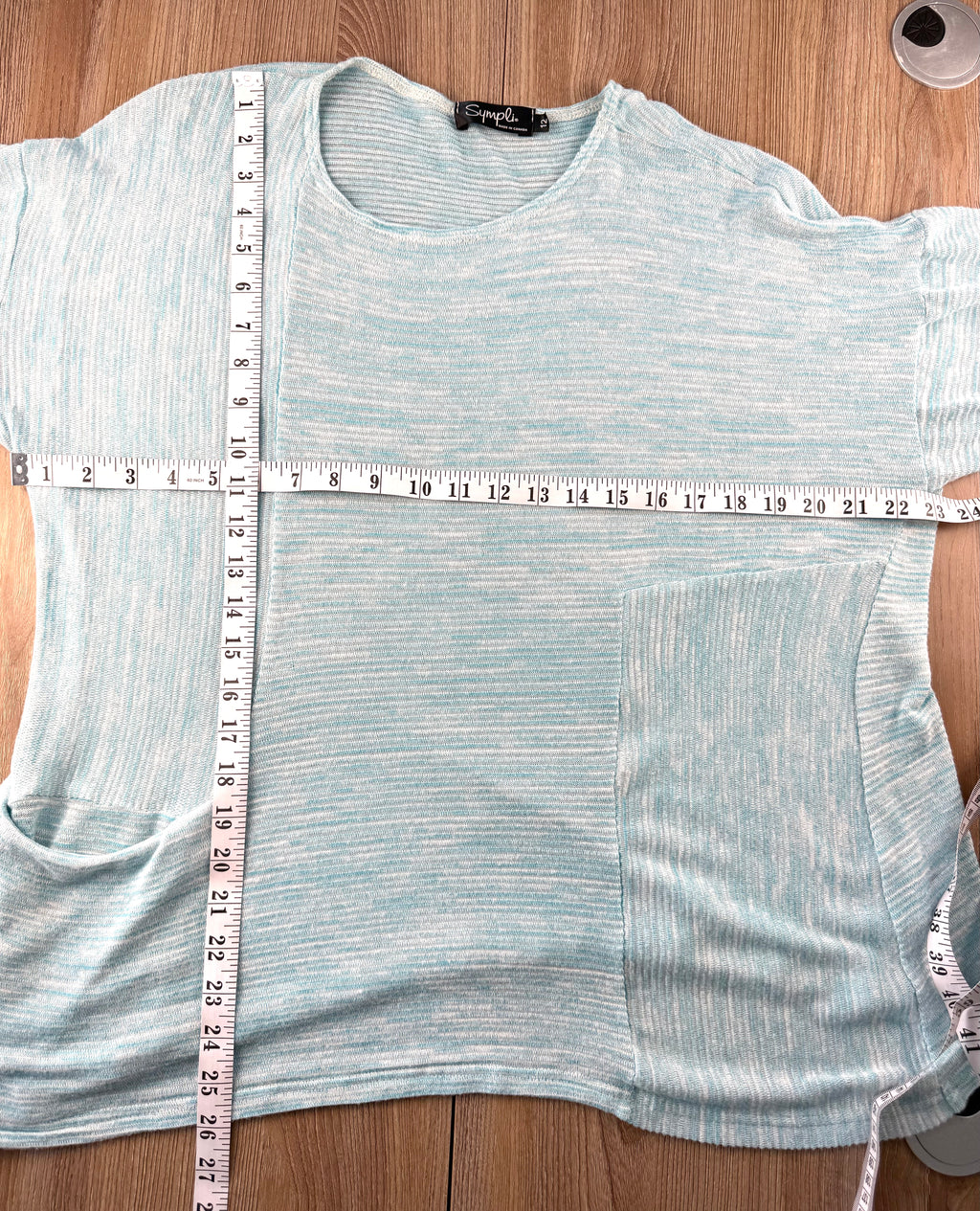 Pale Blue Sympli Knit Tunic Top with front pocket detail measuring 46" bust and 26" shoulder to hem 