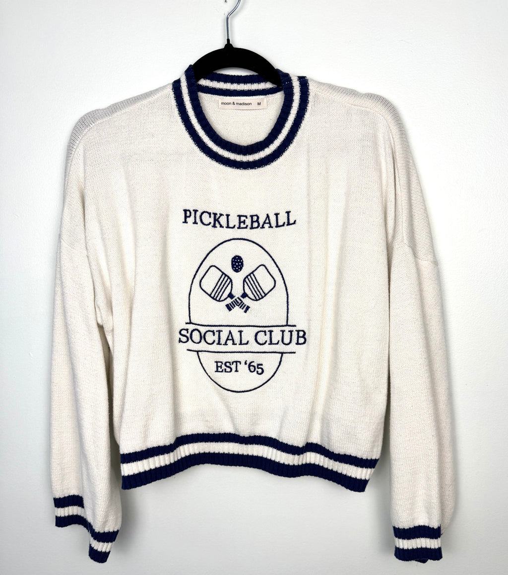 Pickleball varsity stripe knit sweater  on hanger 