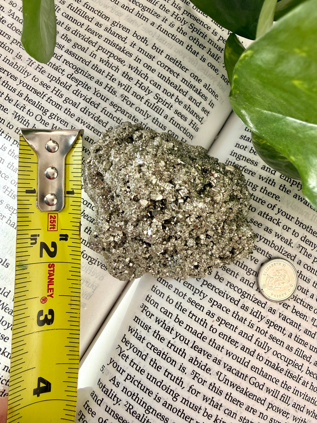 pyrite with measuring tape showing it to be about 2 " high 
