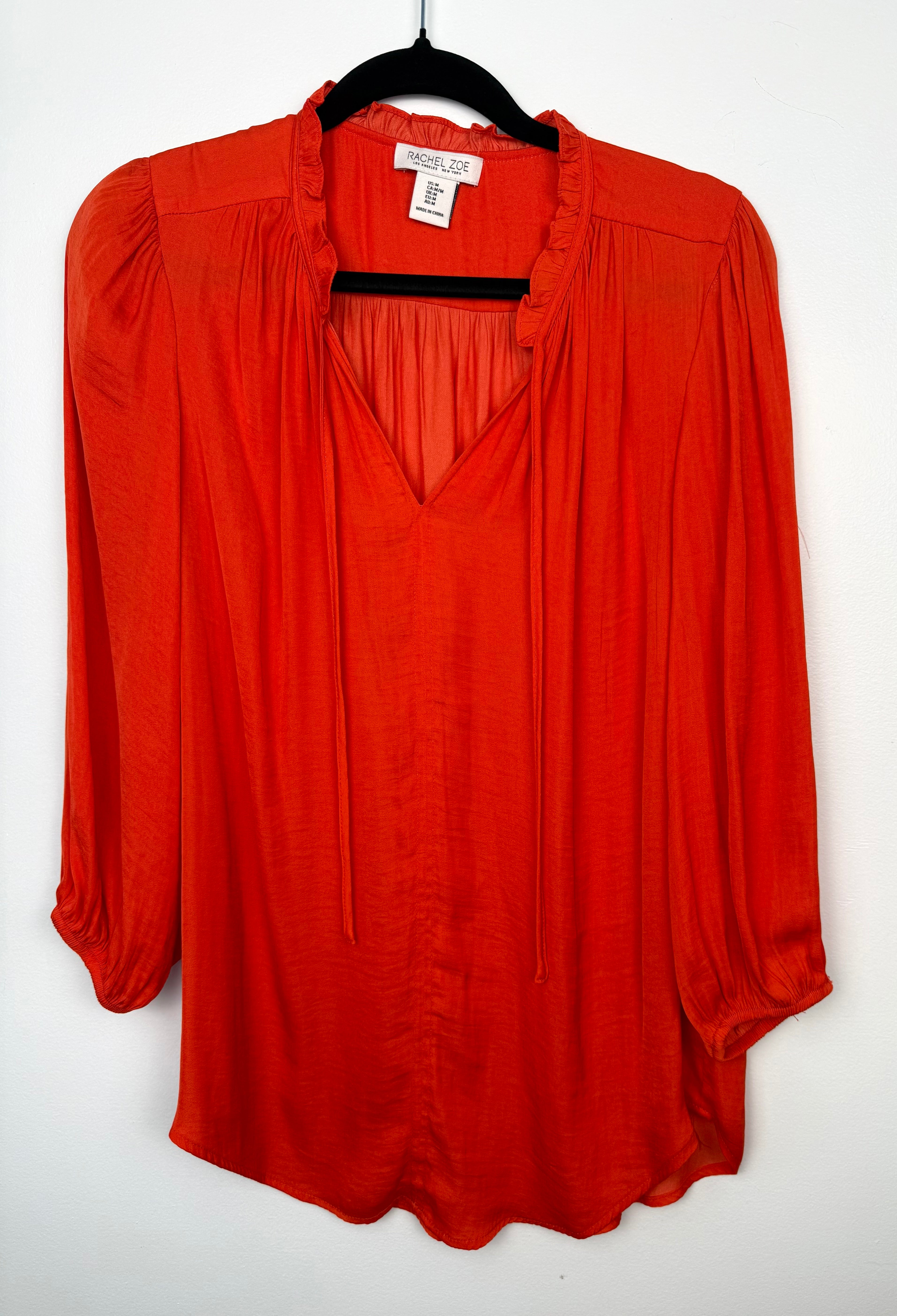 Rachel Zoe Vibrant Orange boho blouse on hanger