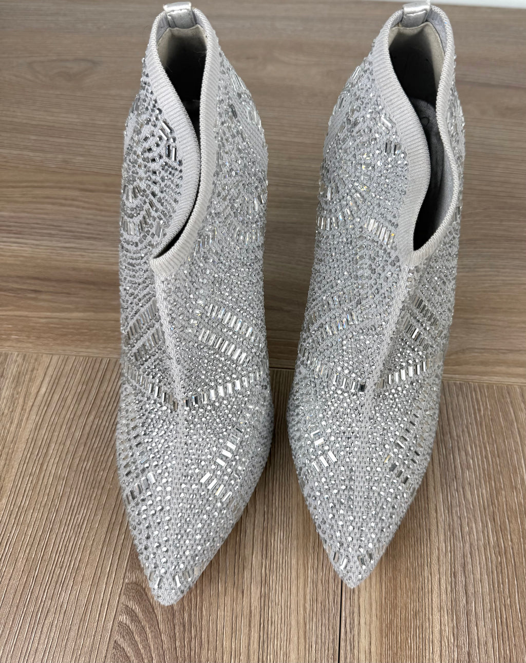 Rhinestone look angle boots | Glitter event boots on table top view 