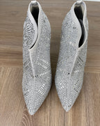 Rhinestone look angle boots | Glitter event boots on table top view 