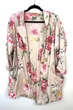Romantic boho oversized floral cotton jacket with hood and patch pockets on black hanger