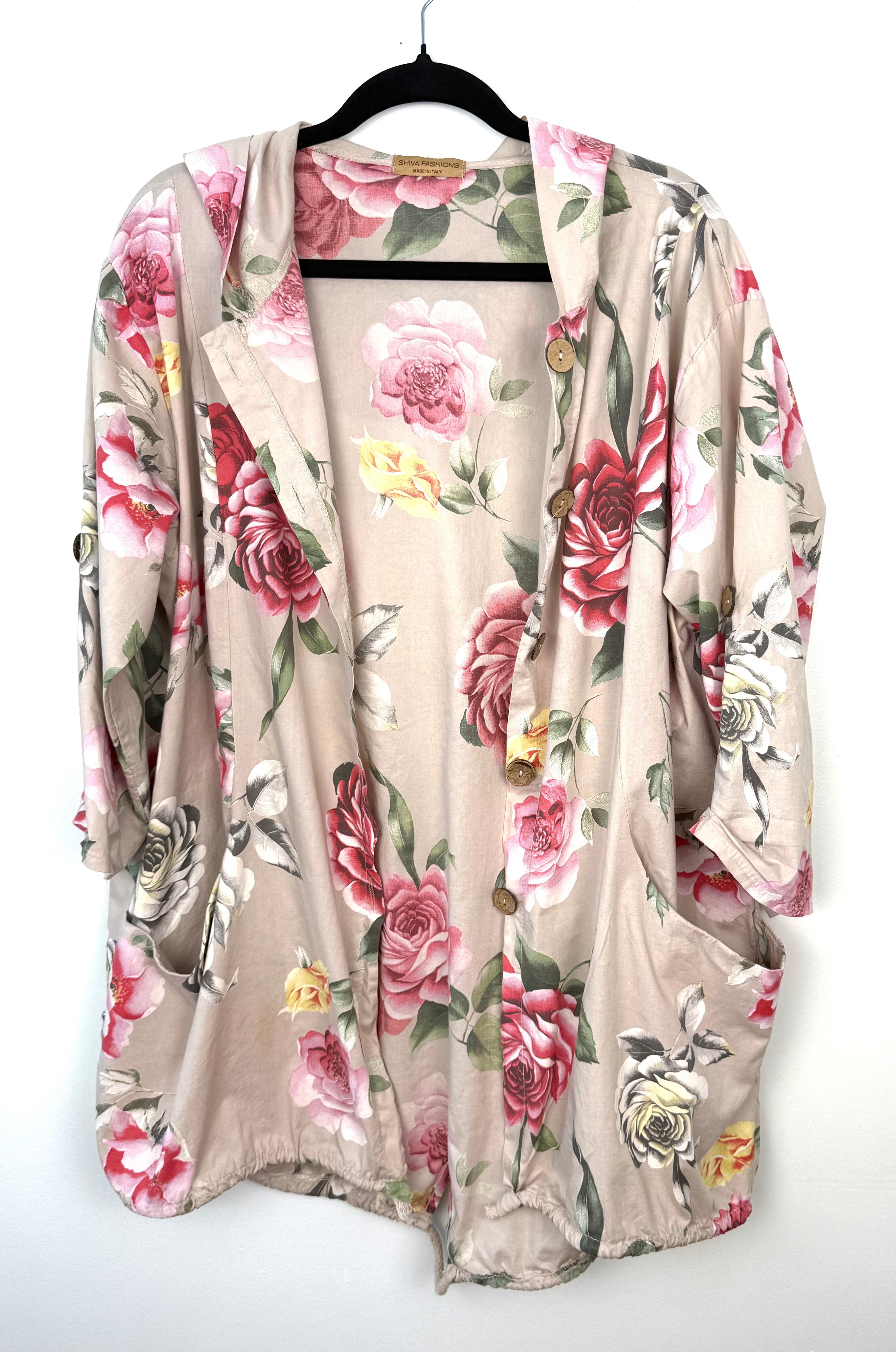 Romantic boho oversized floral cotton jacket with hood and patch pockets on black hanger