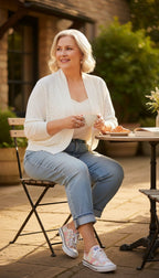 Ronni Nicole Ivory Pearl Cardigan | Size L at Blue Sparrow SHop on woman drinking coffee outside 