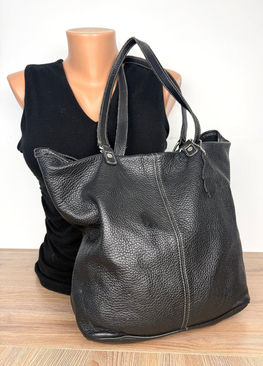 Roots Canada Black Pebbled Leather Tote bag  on mannequin to show size 