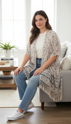Roots Canada Lightweight Geometric Print Fringe Kimono | One Size at Blue Sparrow Shop on woman sitting on edge of couch