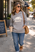 Roots Canada Pullover Hoodie | Size L at Blue Sparrow Shop on woman walking outside