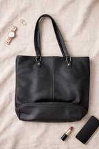 Roots black pebbled leather bag at Blue Sparrow 
