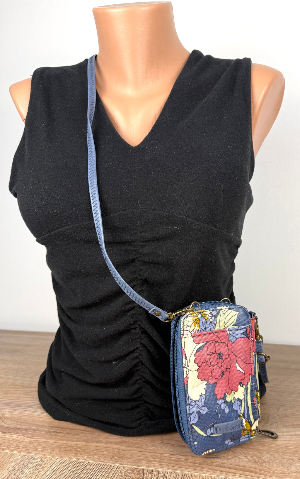 Sakroots Floral Crossbody Phone Wallet  on mannequin to show size