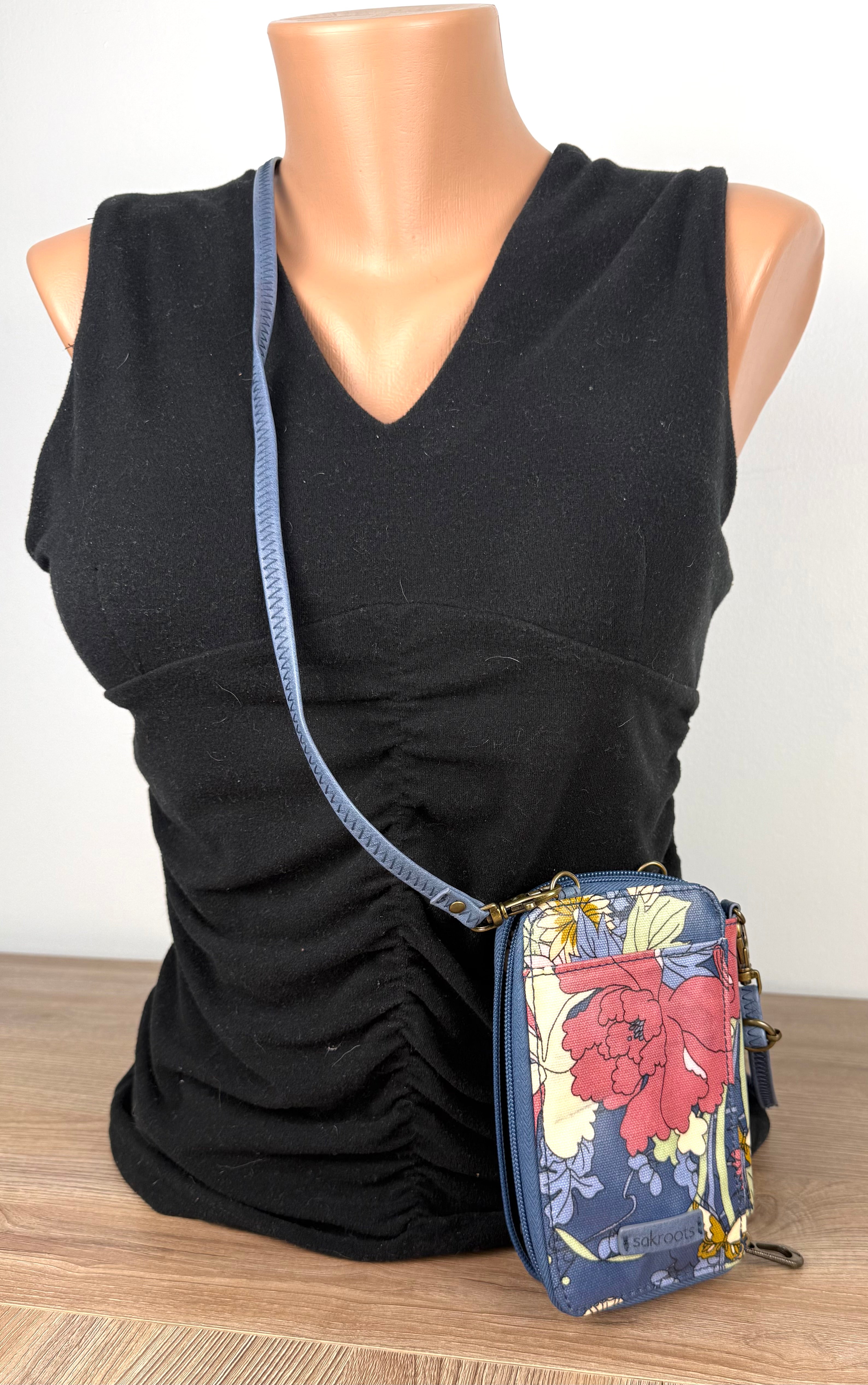 Sakroots Floral Crossbody Phone Wallet  on mannequin to show size