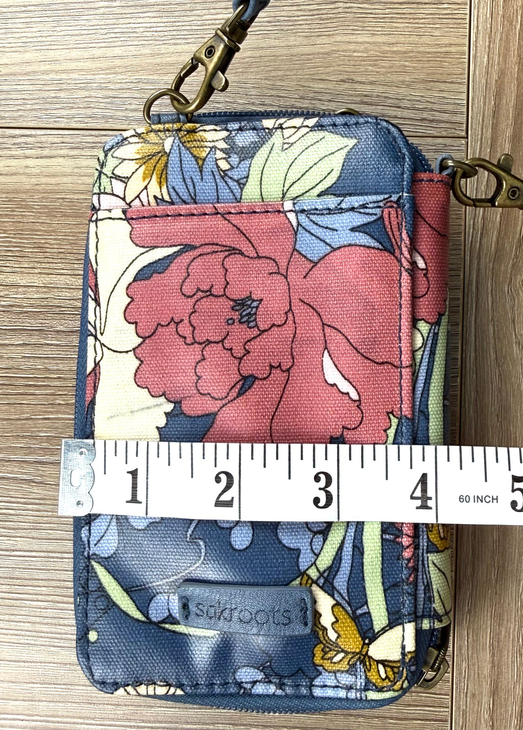 Sakroots Floral Crossbody Phone Wallet  measuring 4" wide 
