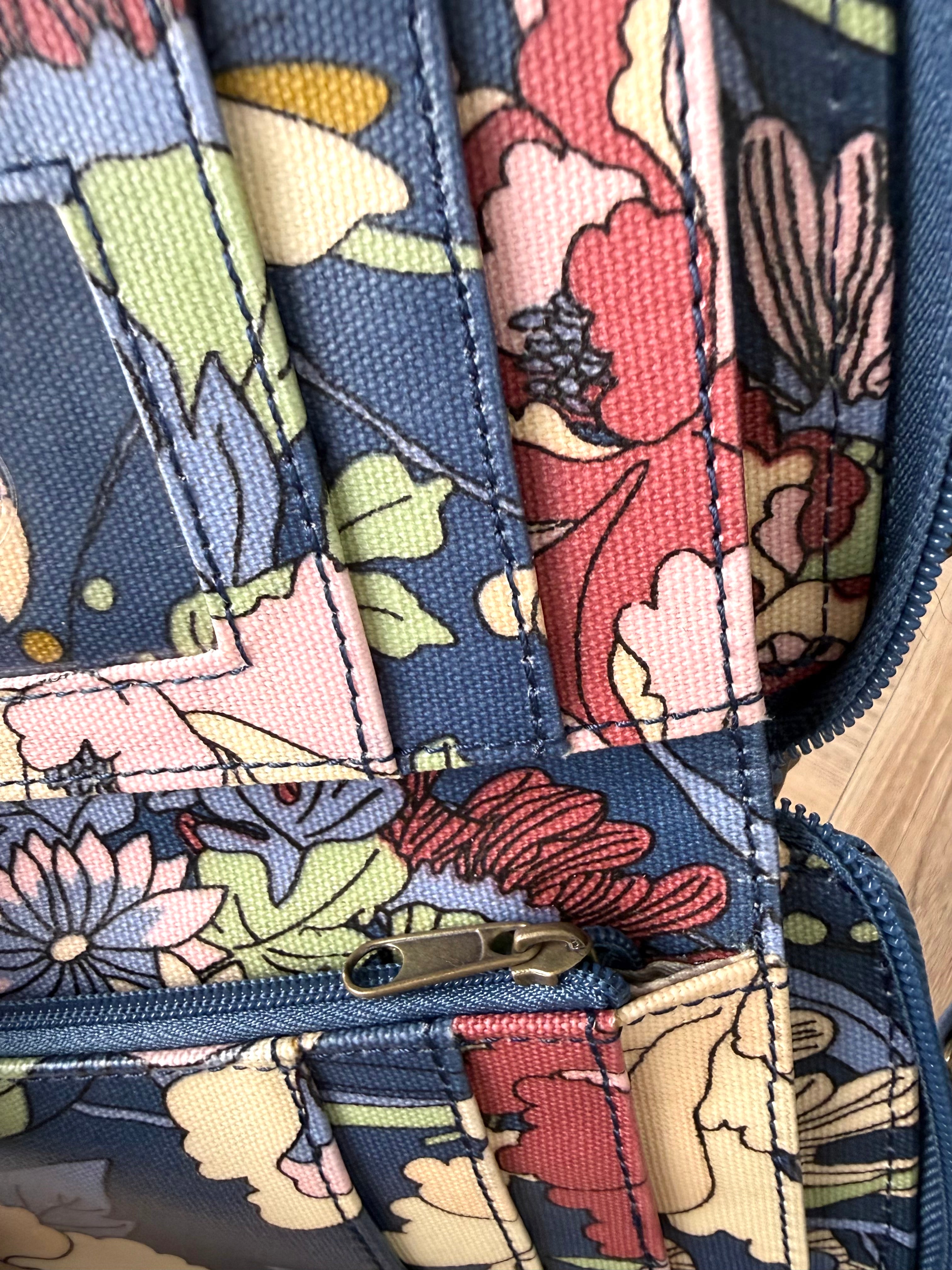 Sakroots Floral Crossbody Phone Wallet  showing inside paper money section, cards and zipper 