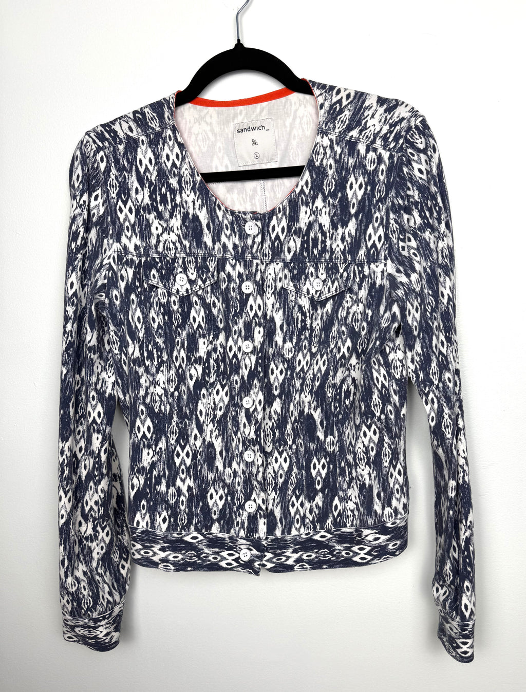 Sandwich blue white ikat print cotton stretch jacket button front cropped blazer women size large with flap pockets and long sleeves.