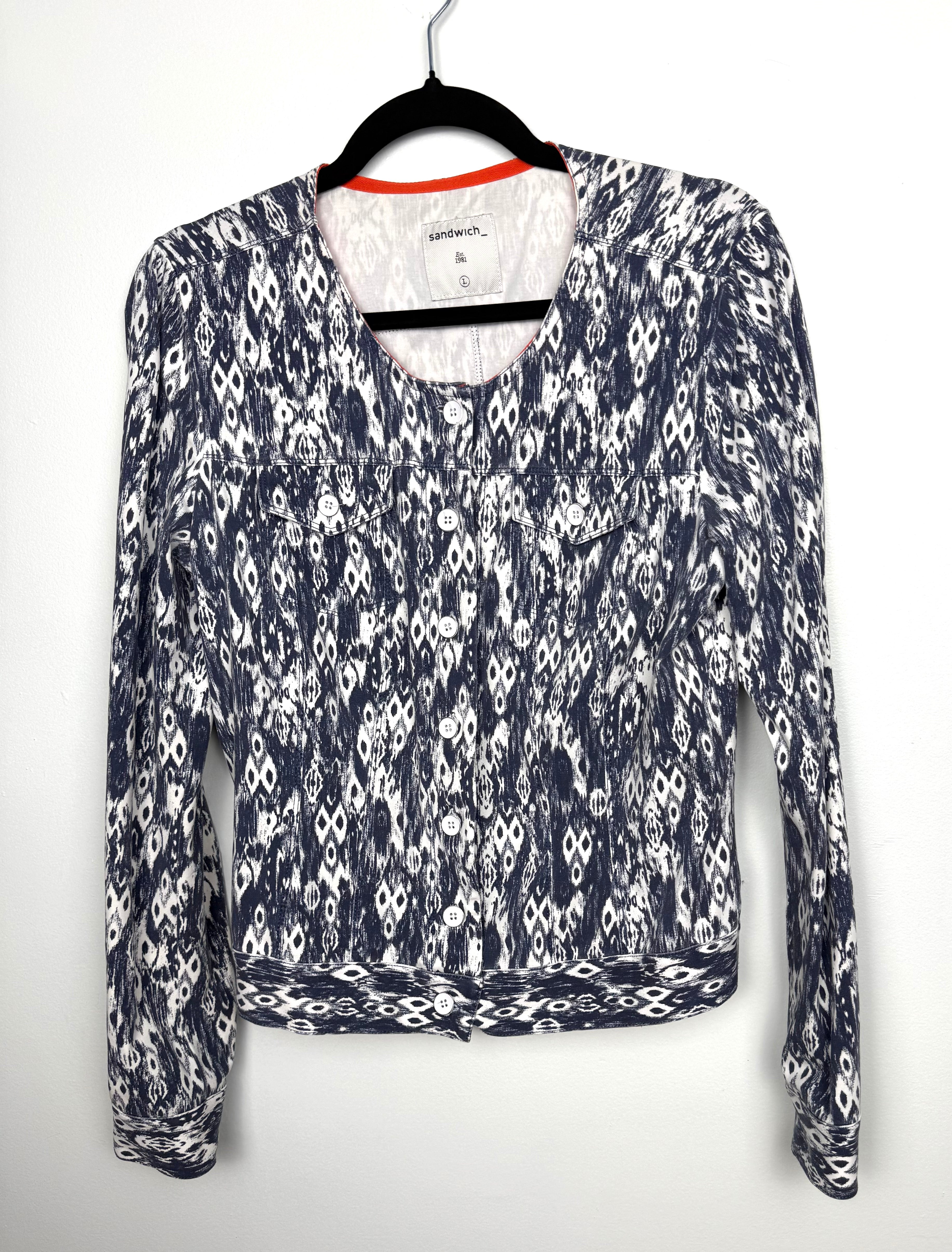 Sandwich blue white ikat print cotton stretch jacket button front cropped blazer women size large with flap pockets and long sleeves.