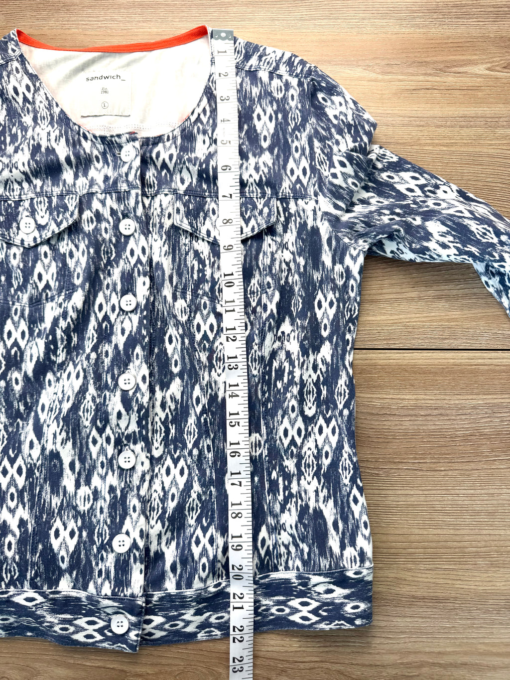 Sandwich brand jacket measuring 22" from shoulder to hem