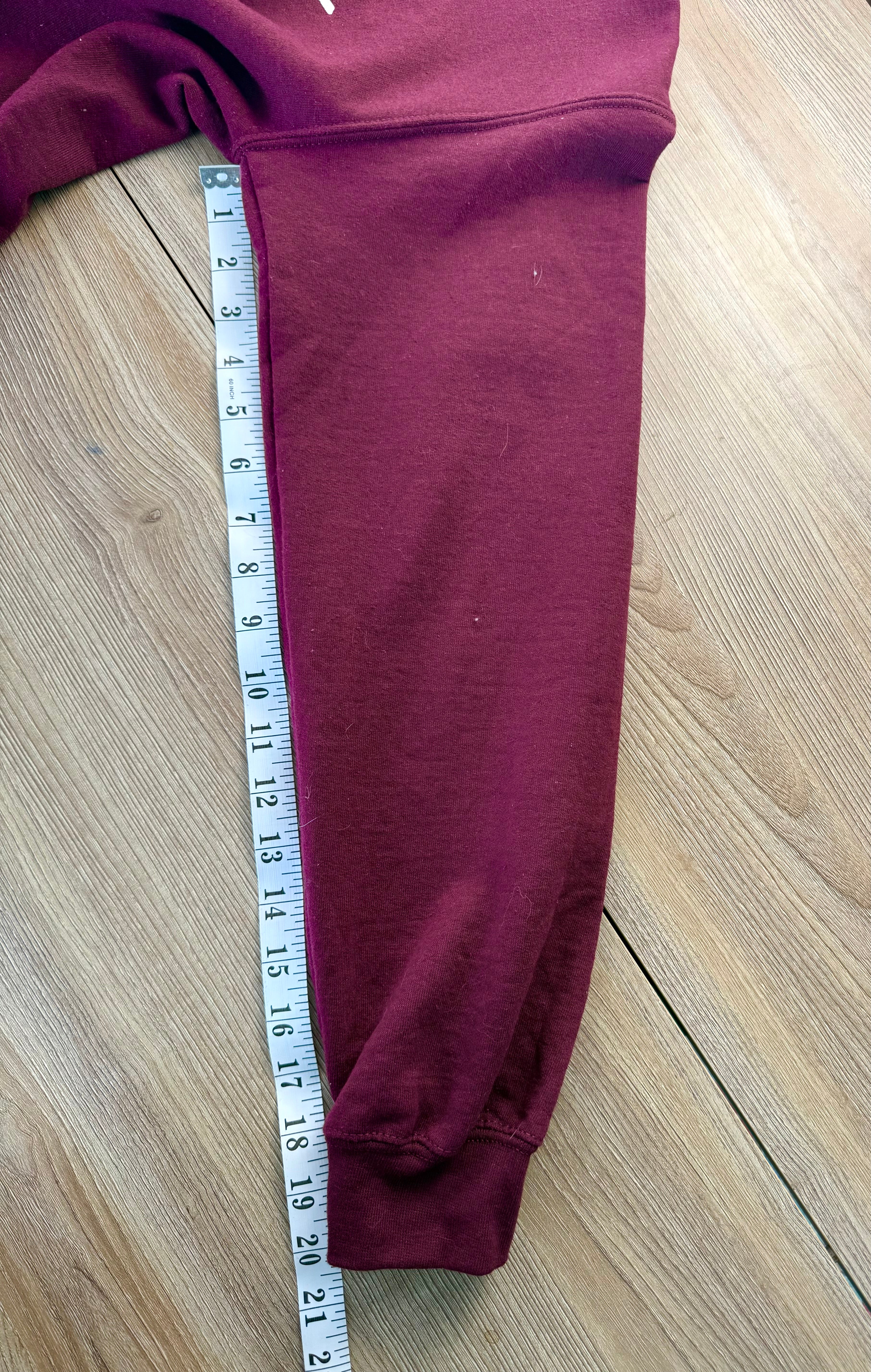 Schitts Creek Rose Apothecary sweatshirt measuring 20" sleeve length