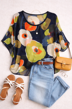 Sheer Abstract Floral Blouse | Oversized Plus at Blue Sparrow Shop on woman outside lifestyle flatlay with jeans, sandals, purse