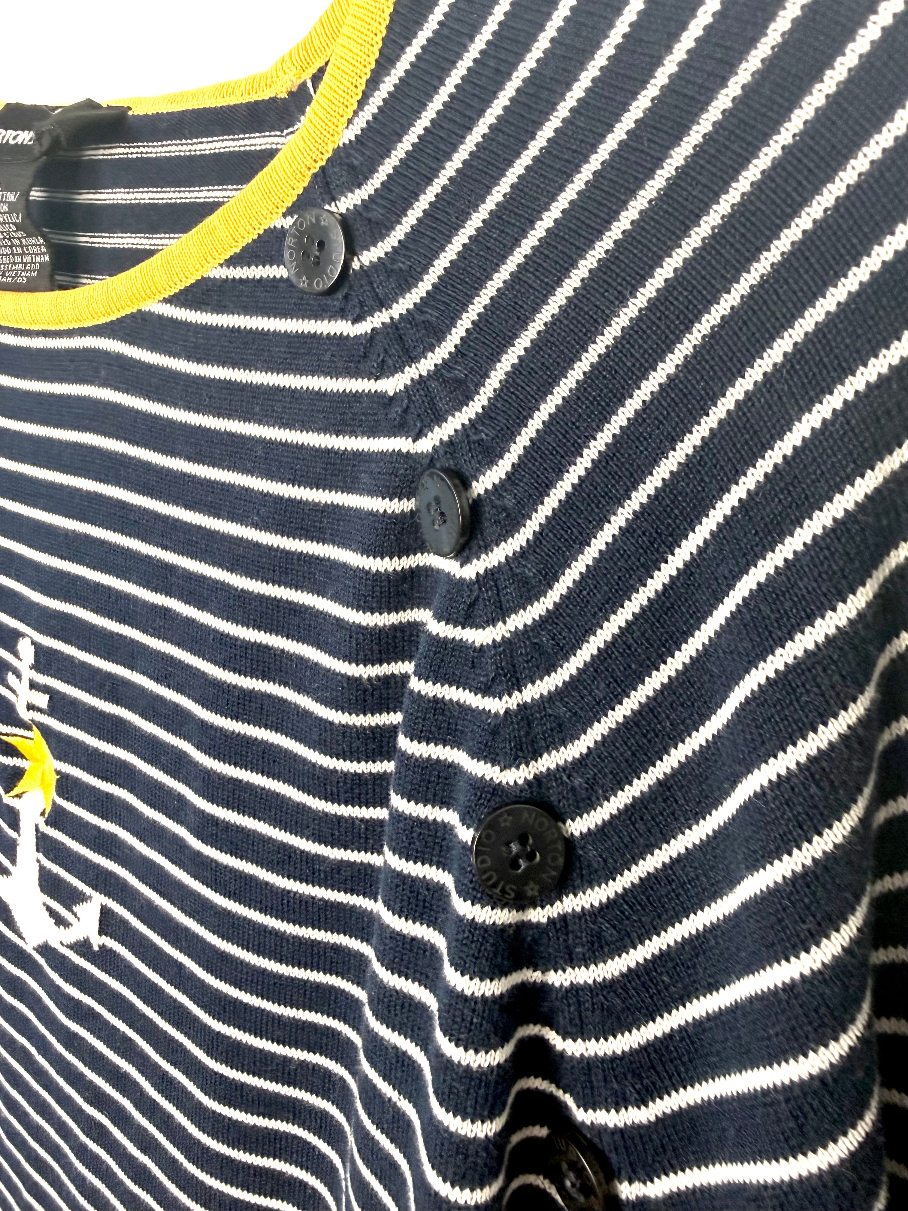 Shoulder button detail on navy and white striped nautical sweater.