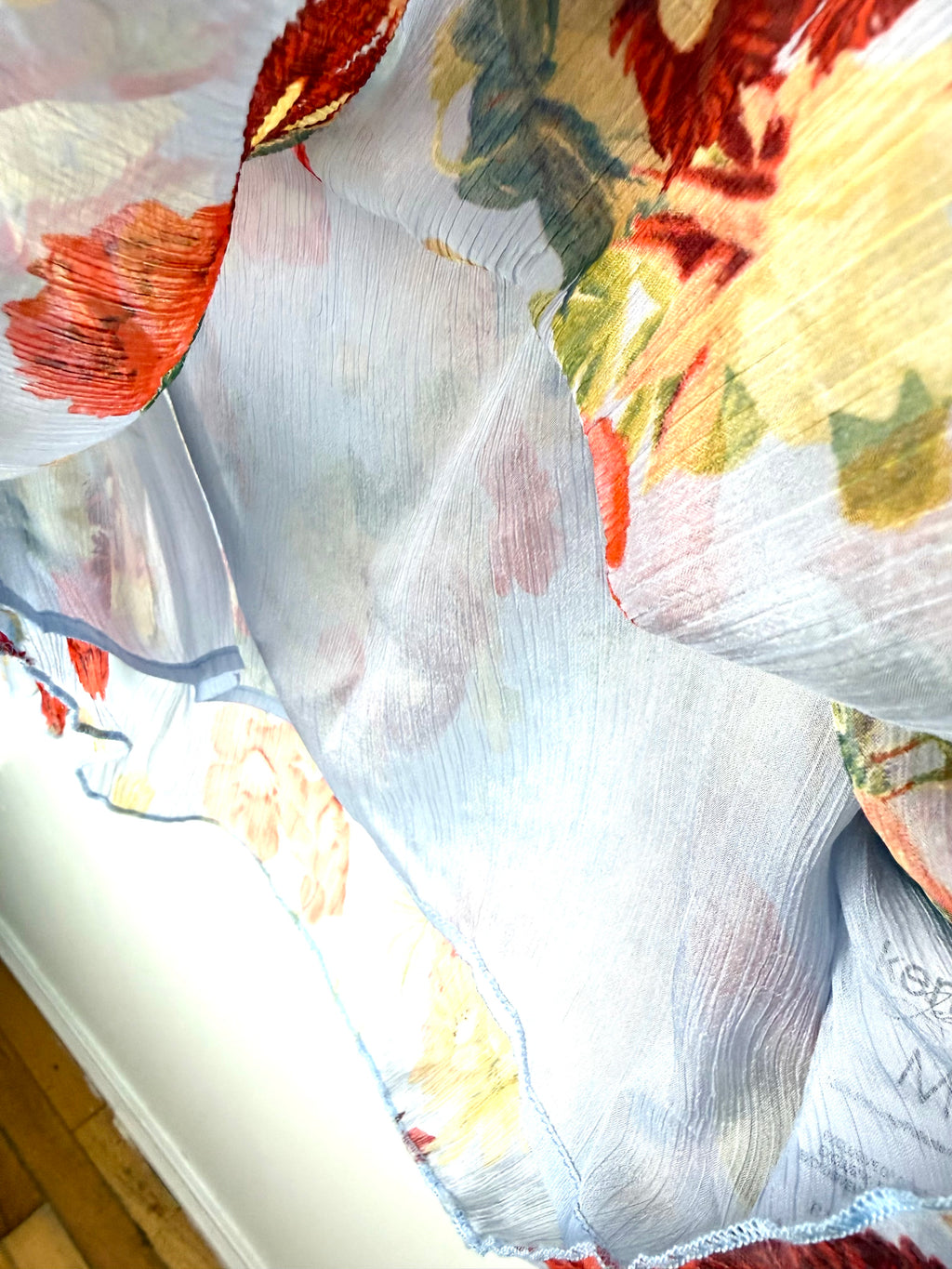 Shows sheer layer inside Kensie floral summer blouse