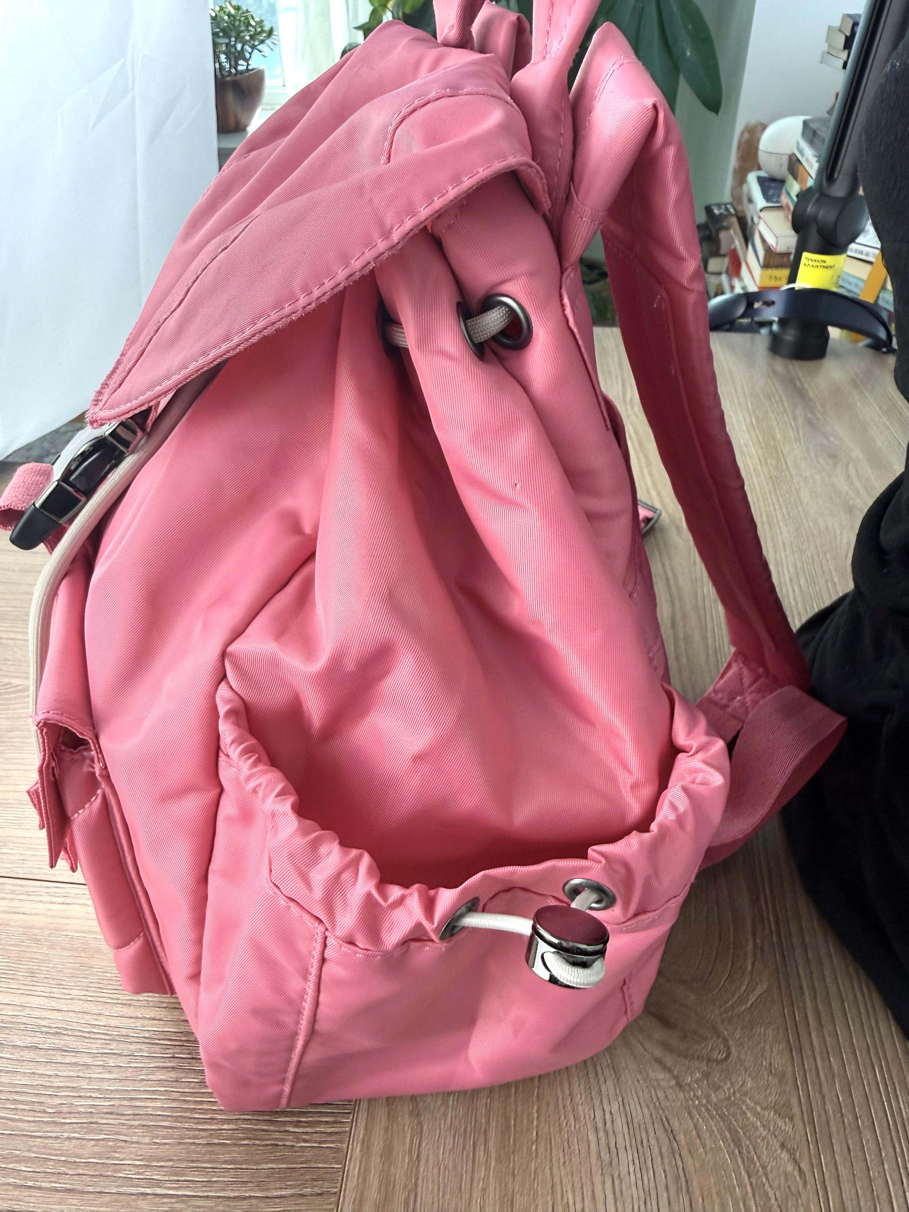 Side pocket detail on Lug Wiffle backpack in pink
