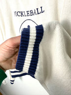 Sleeve of varsity Pickleball country club sweater by Moon and Madison