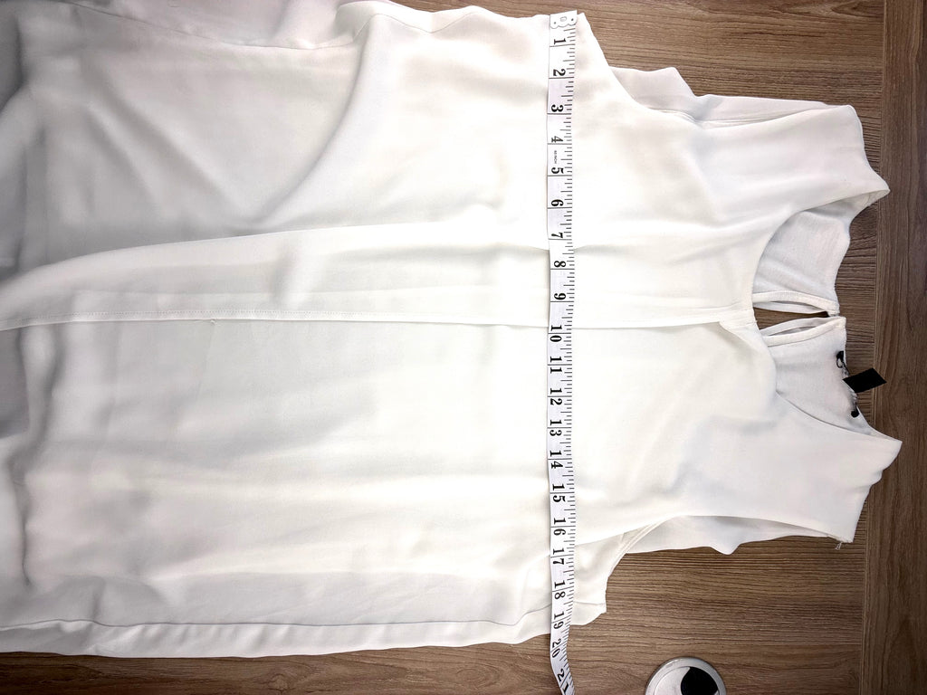 Sleeveless tunic top measuring 38" bust 