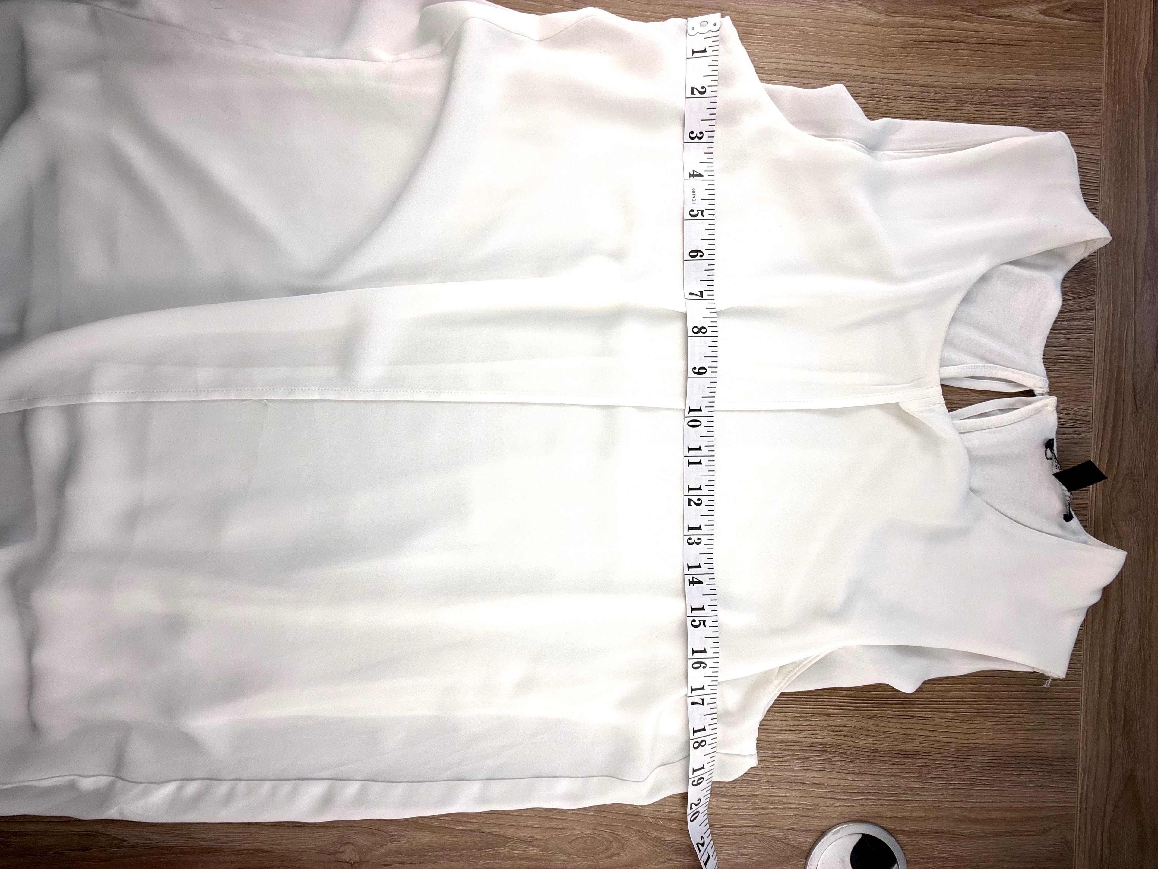 Sleeveless tunic top measuring 38" bust 