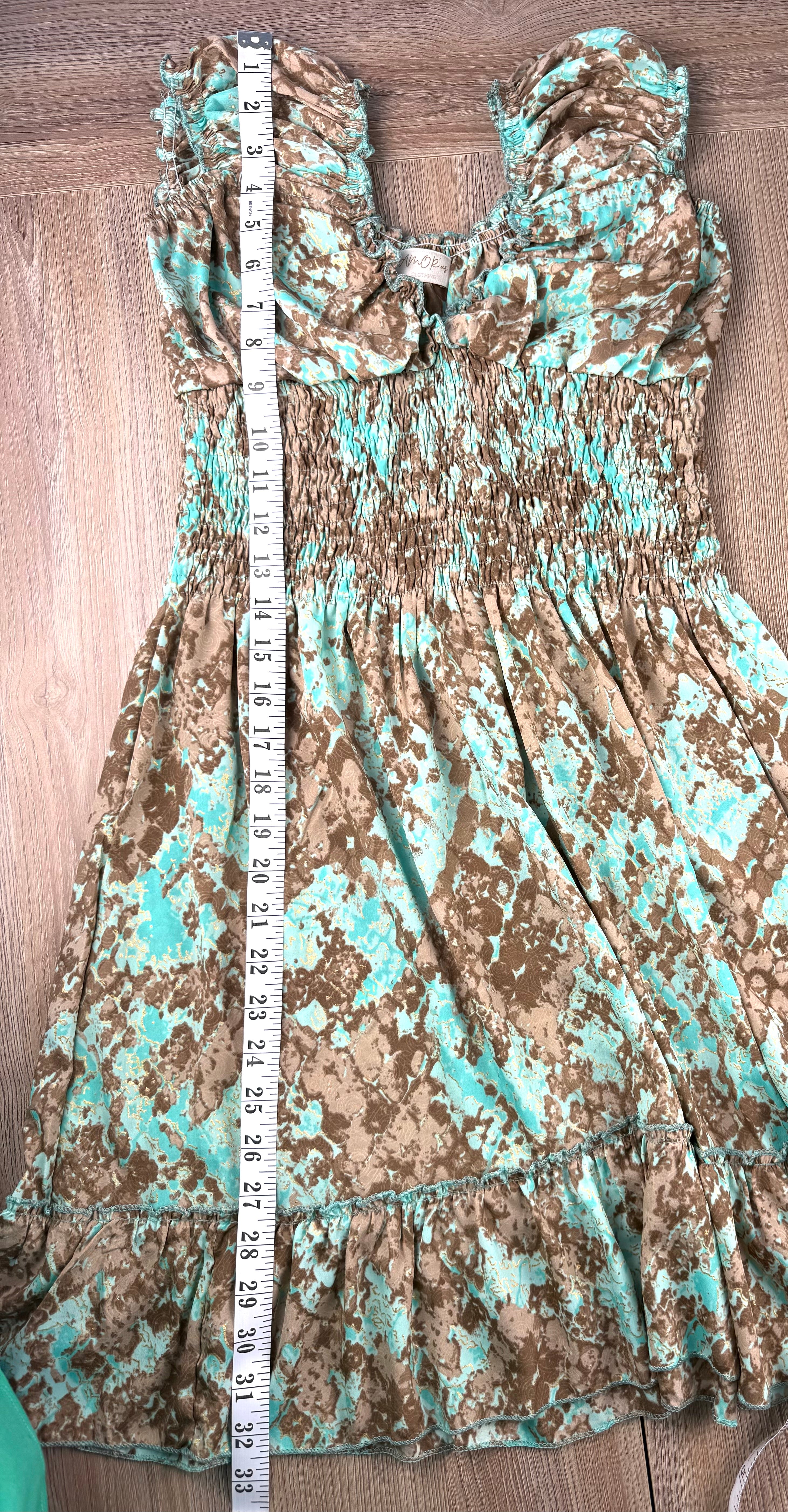 Smocked peasant dress measuring 33" shoulder to hem 
