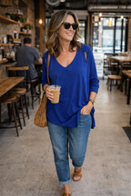 Sympli Asymmetrical Cold-Shoulder V-Neck Top | Size 12 at Blue Sparrow Shop  on woman walking in cafe