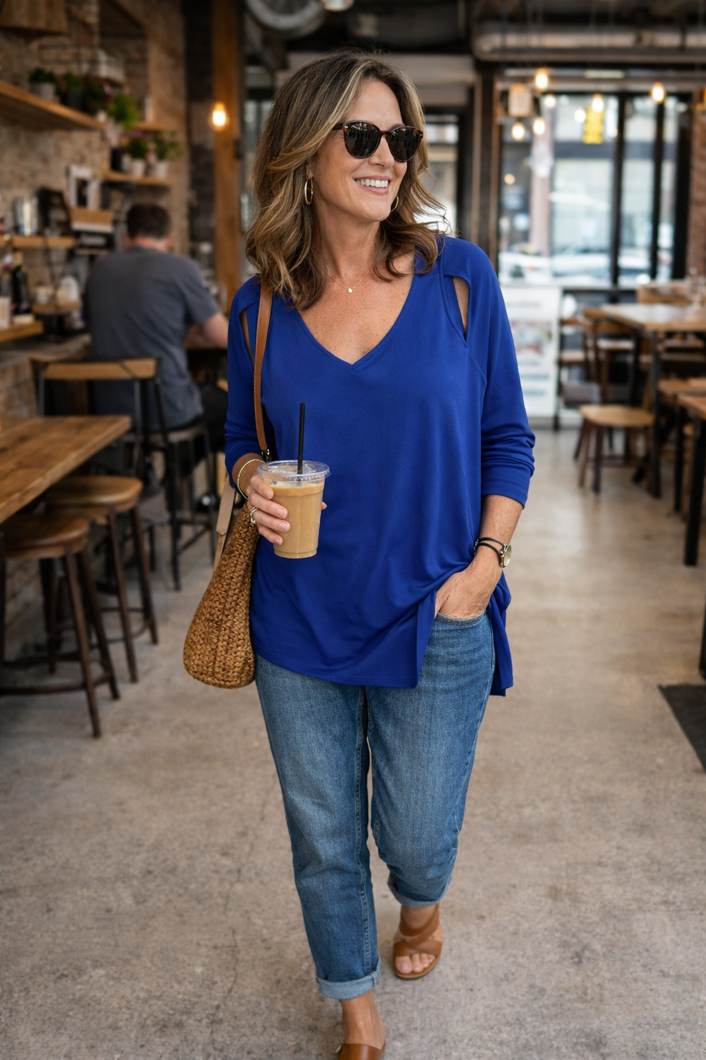 Sympli Asymmetrical Cold-Shoulder V-Neck Top | Size 12 at Blue Sparrow Shop  on woman walking in cafe