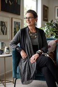 Sympli Made in Canada Black & Grey Mixed Media Long Cardigan | Size 10 on woman sitting in livig room 