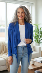 Sympli Made in Canada Waterfall Cardigan — Periwinkle Blue | Ruffle Front | Travel Wear | Size 8 at Blue Sparrow Shop on a woman with grey curly hair wearing jeans and a white t shirt 