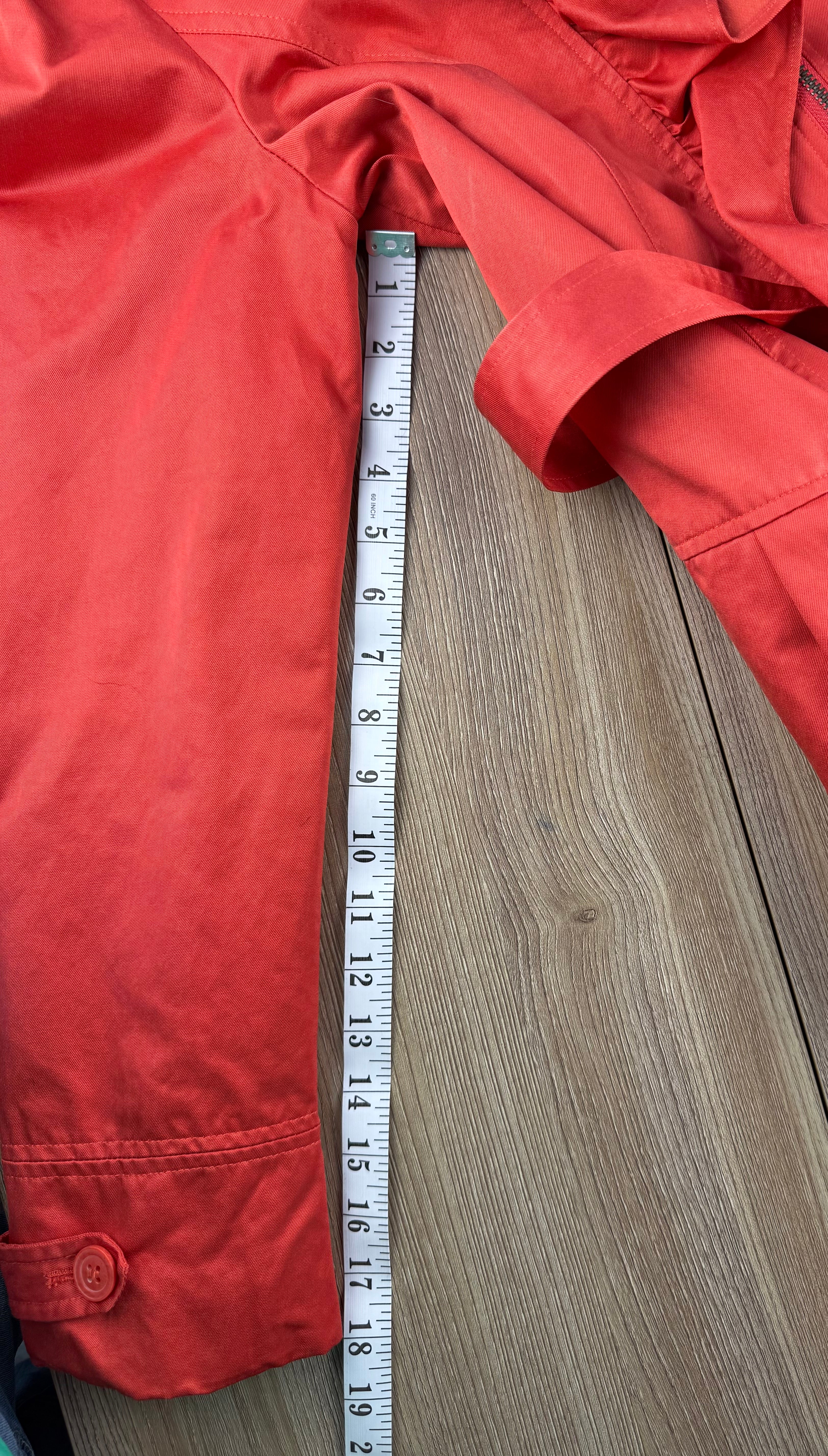 THX Merci Collection Red Ruffle Trench Coat measuring 18" sleeve length