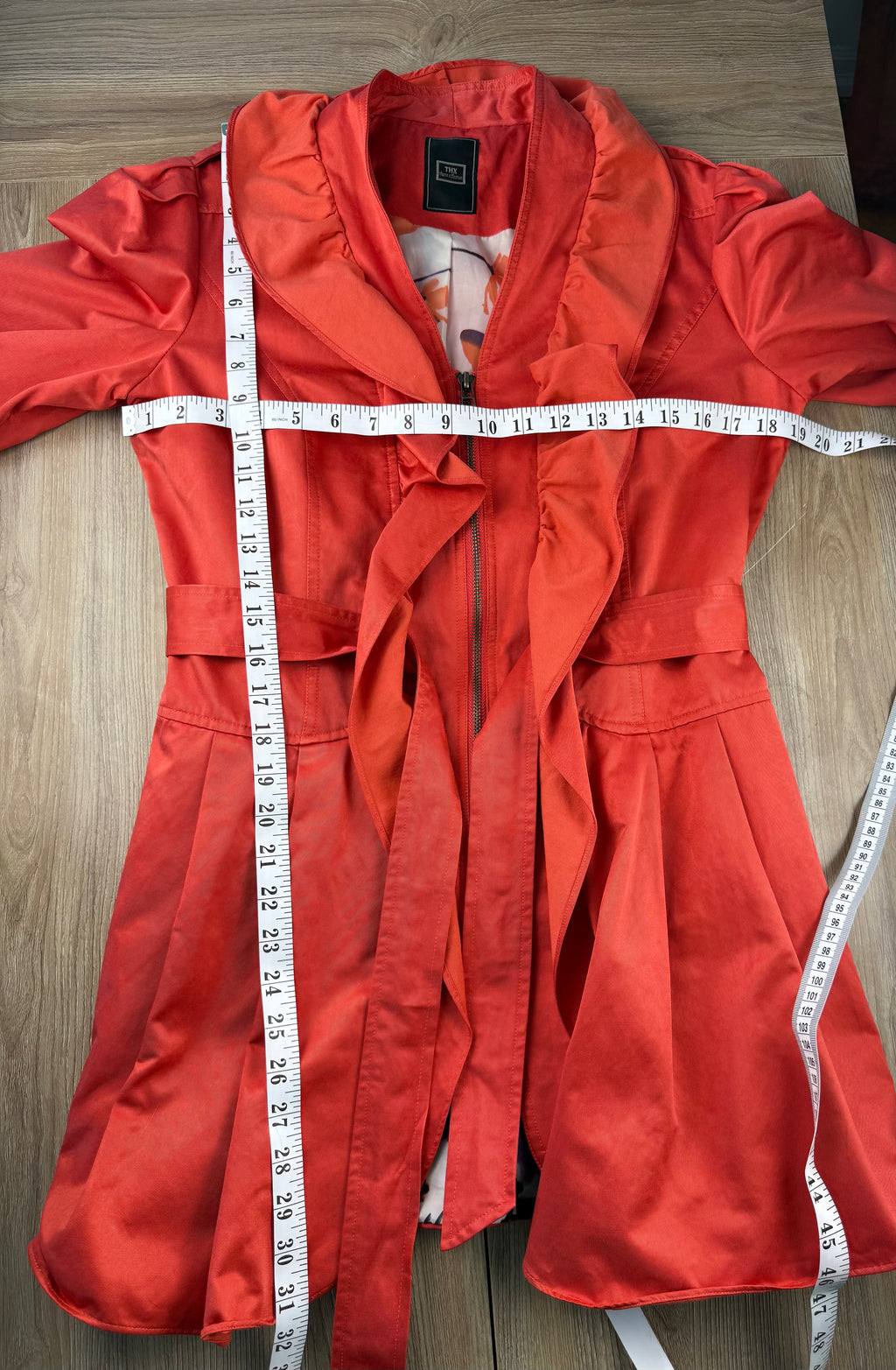 THX Merci Collection Red Ruffle Trench Coat measuring 38" bust  and 31" shoulder to hem  