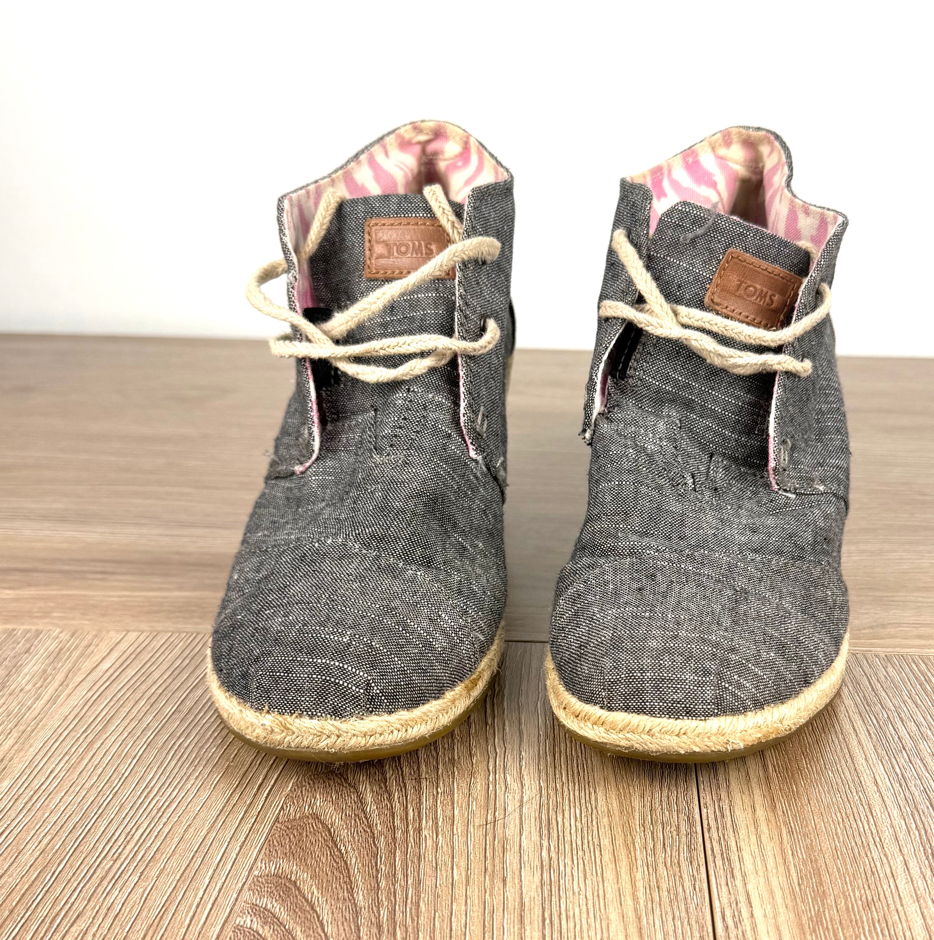 TOMS Chambray Espadrille Wedge Booties on table 