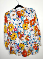 Tribal floral spring top back view on hanger