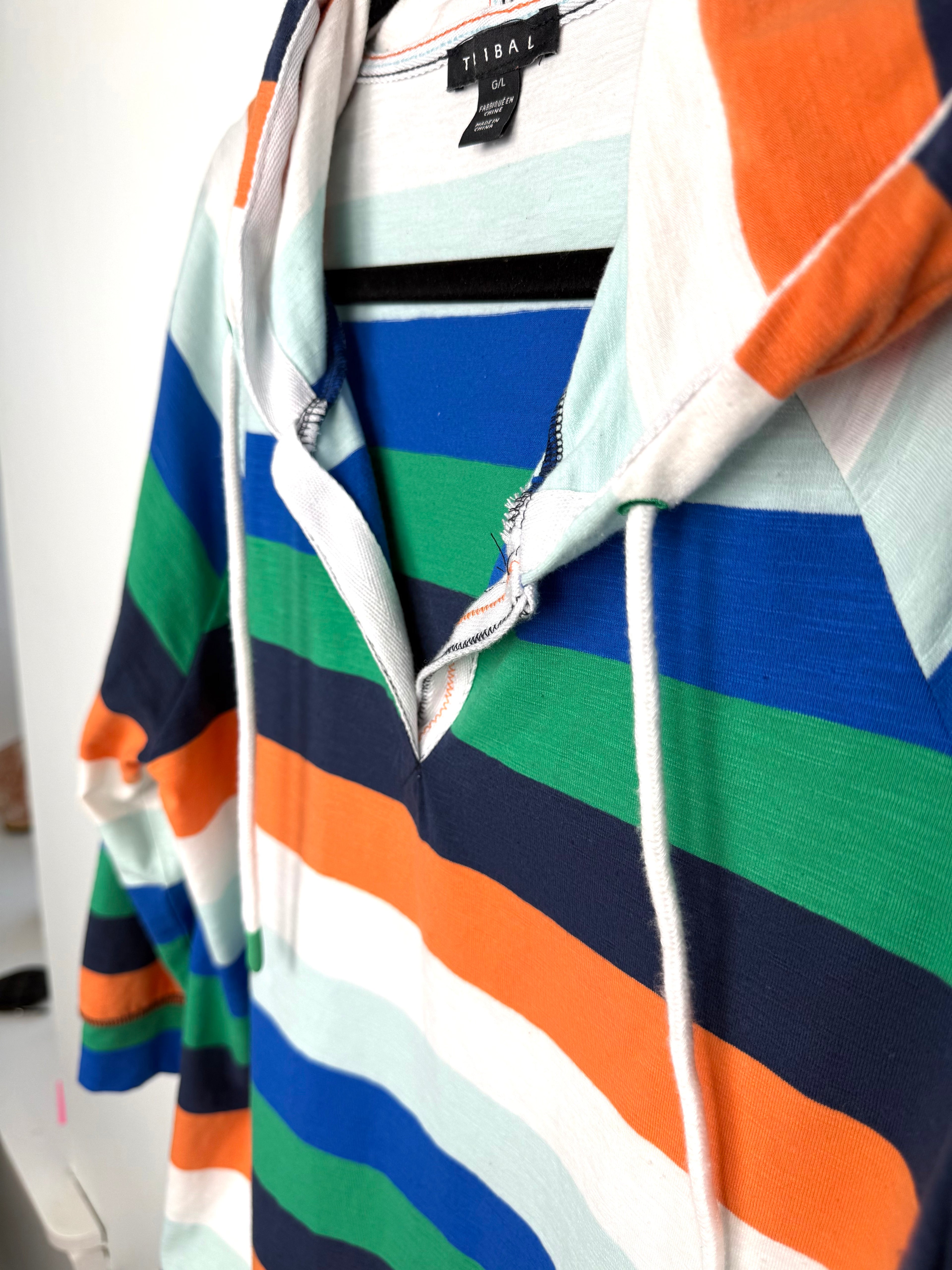 Tribal striped rugby style hooded pullover close up of neckline 