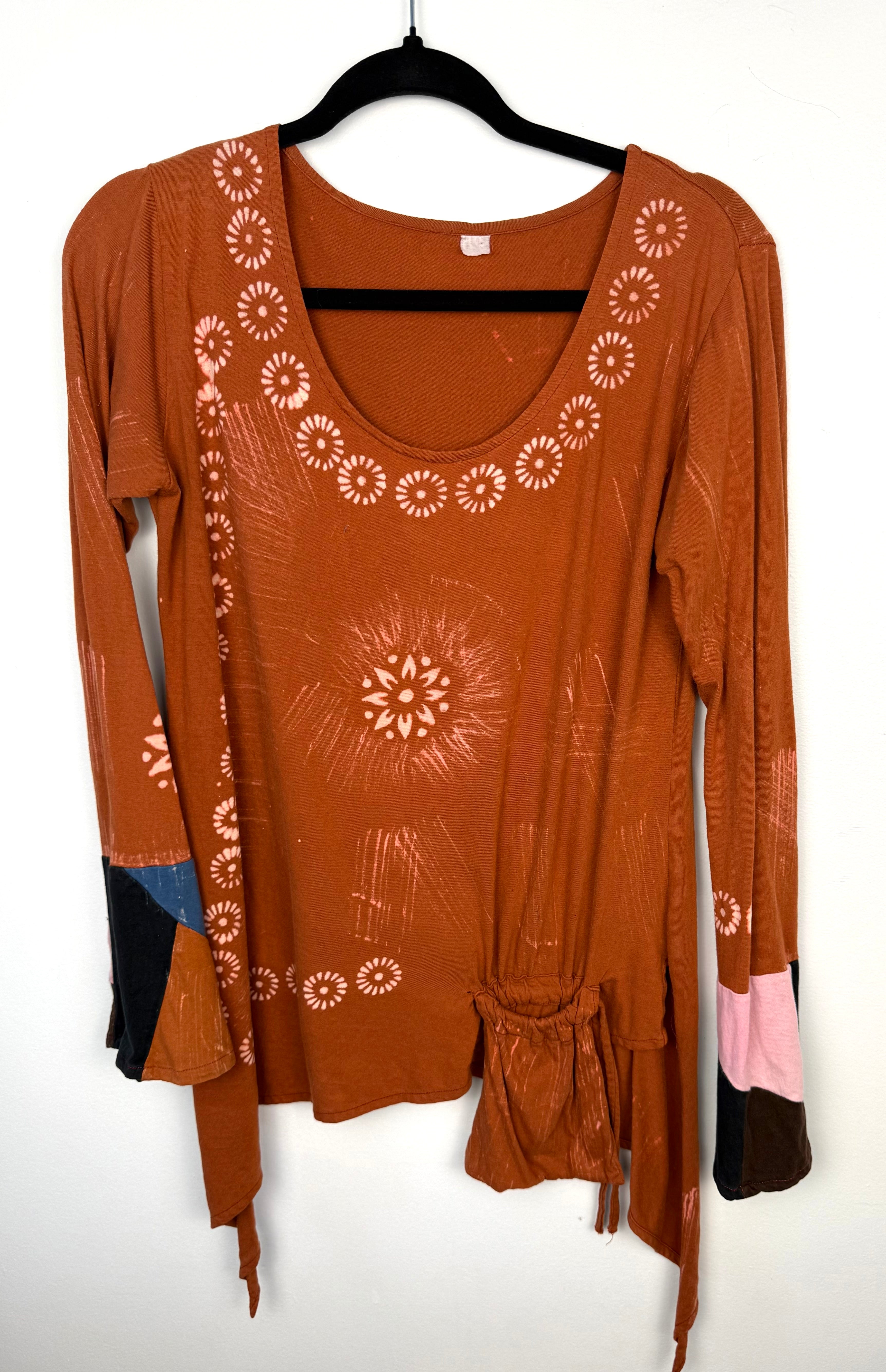 Tye dye boho artsy unique asymmetrical top in burnt orange  front view 